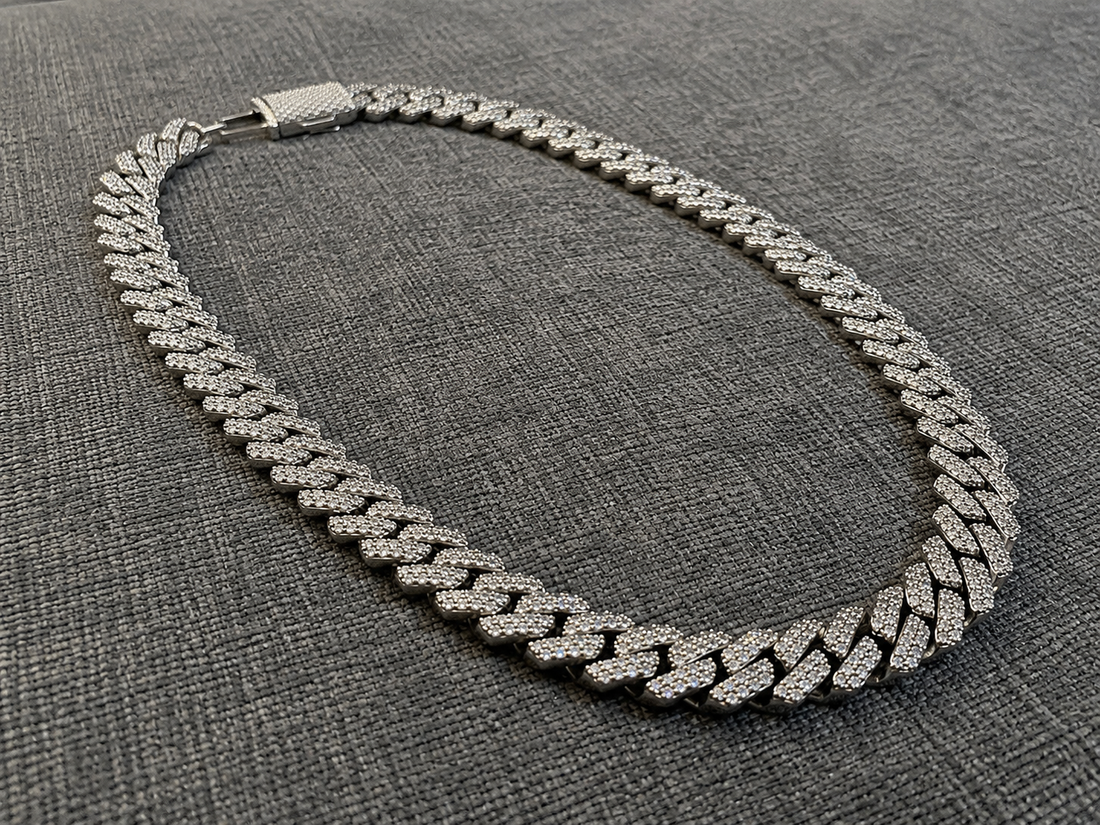 Close angled view of the BLACKTHRONE 12MM Cuban link profile and moissanite setting
